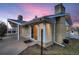 Mid-century modern home showcasing a large window and patio at 34 S Raleigh St, Denver, CO 80219