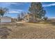 Brick ranch house with detached garage and yard at 34 S Raleigh St, Denver, CO 80219