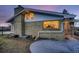 Rear view of house at dusk, showing kitchen window at 34 S Raleigh St, Denver, CO 80219