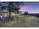 Side view of house at dusk with mountain view at 34 S Raleigh St, Denver, CO 80219