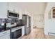 Modern kitchen with stainless steel appliances and granite countertops at 34 S Raleigh St, Denver, CO 80219
