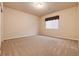 Simple and spacious bedroom with neutral walls and carpet at 27235 E Lakeview Pl, Aurora, CO 80016