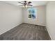 Spacious bedroom featuring a ceiling fan and large window with shutters at 16130 Pitchford Pl, Parker, CO 80134