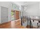 Bright and spacious entryway with hardwood floors, modern lighting, and glass railings at 1082 W Meadow Rd, Evergreen, CO 80439
