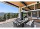 Deck with fire pit and views, open to living area at 1082 W Meadow Rd, Evergreen, CO 80439