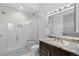 Bathroom with a walk-in shower and marble vanity at 1082 W Meadow Rd, Evergreen, CO 80439