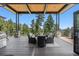 Spacious deck with mountain views and outdoor seating at 1082 W Meadow Rd, Evergreen, CO 80439