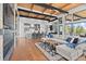 Open floor plan living room and kitchen with large windows at 1082 W Meadow Rd, Evergreen, CO 80439
