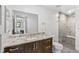 Modern bathroom with a walk-in shower and marble vanity at 1082 W Meadow Rd, Evergreen, CO 80439