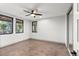 Bright and airy bedroom with large windows and neutral carpeting at 1082 W Meadow Rd, Evergreen, CO 80439
