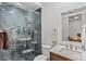 Bathroom with walk-in shower, marble vanity, and modern fixtures at 1082 W Meadow Rd, Evergreen, CO 80439