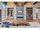 Spacious living room with stone fireplace and built-in shelving at 1082 W Meadow Rd, Evergreen, CO 80439