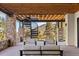 Covered patio with mountain views and comfortable seating at 1082 W Meadow Rd, Evergreen, CO 80439