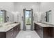 Spa-like bathroom with double vanities, large soaking tub, and walk-in shower at 1082 W Meadow Rd, Evergreen, CO 80439