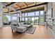 Living area with expansive windows and mountain views at 1082 W Meadow Rd, Evergreen, CO 80439