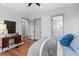 Bedroom with wood floors, and access to bathroom and hallway at 1082 W Meadow Rd, Evergreen, CO 80439
