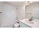 Clean bathroom with white tile, vanity, and bathtub at 10291 E 62Nd Pl, Denver, CO 80238