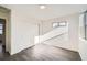 Bright bedroom with wood-look floors and sliding closet doors at 10291 E 62Nd Pl, Denver, CO 80238