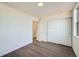 Spacious bedroom with wood-look floors and an open door at 10291 E 62Nd Pl, Denver, CO 80238