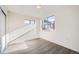 Bright bedroom with hardwood floors and large windows at 10291 E 62Nd Pl, Denver, CO 80238