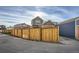 Modern home exterior with wood fence and attached garage at 10291 E 62Nd Pl, Denver, CO 80238