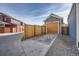 Detached garage with a new orange door and driveway at 10291 E 62Nd Pl, Denver, CO 80238