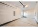 Unfinished garage with an additional door to backyard at 10291 E 62Nd Pl, Denver, CO 80238