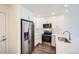 Modern kitchen with stainless steel appliances and white cabinetry at 10291 E 62Nd Pl, Denver, CO 80238
