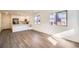 Modern kitchen with white cabinets and stainless steel appliances at 10291 E 62Nd Pl, Denver, CO 80238
