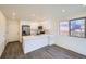 Modern kitchen featuring white cabinets and stainless steel appliances at 10291 E 62Nd Pl, Denver, CO 80238