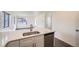 Modern kitchen with white cabinets, quartz countertops and stainless steel appliances at 10291 E 62Nd Pl, Denver, CO 80238