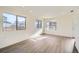 Living room with hardwood floors and multiple windows at 10291 E 62Nd Pl, Denver, CO 80238