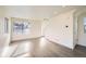 Bright living room with hardwood floors and large windows at 10291 E 62Nd Pl, Denver, CO 80238