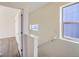 Bright stairwell with access to upper level and additional rooms at 10291 E 62Nd Pl, Denver, CO 80238