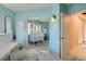 Bright bedroom with mirrored closet doors and light teal walls at 3001 Eagle Ridge Rd, Longmont, CO 80503
