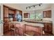 Kitchen with granite countertops and dark wood cabinets at 3001 Eagle Ridge Rd, Longmont, CO 80503