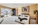 Bright bedroom with access to backyard and built-in shelving at 3001 Eagle Ridge Rd, Longmont, CO 80503