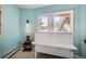 Cozy basement room with built-in white cabinet and window views at 3001 Eagle Ridge Rd, Longmont, CO 80503