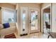 Bright entryway with window seat and door leading to patio at 3001 Eagle Ridge Rd, Longmont, CO 80503