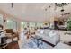 Open living area featuring hardwood floors and access to deck at 3001 Eagle Ridge Rd, Longmont, CO 80503
