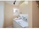 Laundry room with washer, dryer, and overhead cabinets at 3001 Eagle Ridge Rd, Longmont, CO 80503