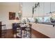 Bright dining area with hardwood floors and modern table at 3001 Eagle Ridge Rd, Longmont, CO 80503