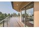 Large deck with mountain views and sliding glass doors leading to the interior at 3001 Eagle Ridge Rd, Longmont, CO 80503