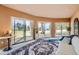 Living room with sliding doors to patio and scenic views at 3001 Eagle Ridge Rd, Longmont, CO 80503