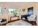 Relaxing sitting area with a comfy chair and natural light at 3001 Eagle Ridge Rd, Longmont, CO 80503