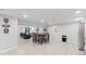 Open concept basement with dining area and living room at 3067 S Holly Pl, Denver, CO 80222