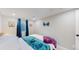 Basement bedroom with a queen bed and teal bedding at 3067 S Holly Pl, Denver, CO 80222