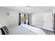 Charming bedroom with a comfortable bed, and a view of the backyard at 3067 S Holly Pl, Denver, CO 80222