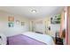Cozy bedroom with a large bed, hardwood floors, and access to multiple closets at 3067 S Holly Pl, Denver, CO 80222