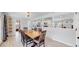 Open concept dining room with kitchen and views to the living room at 3067 S Holly Pl, Denver, CO 80222